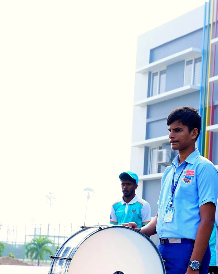 A student drummer leading the Bellwether assembly band