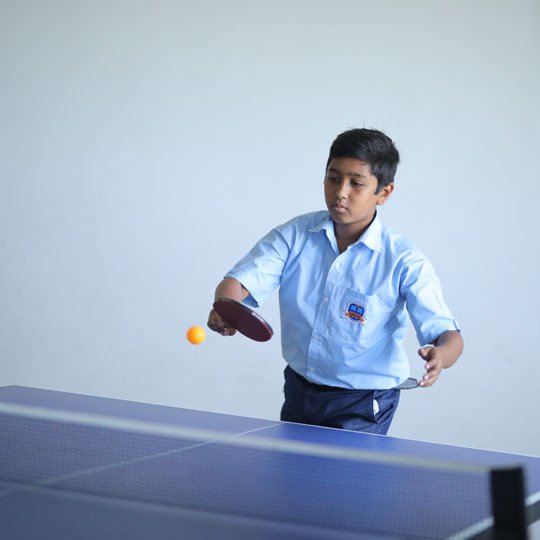 A Bellwether student playing table tennis